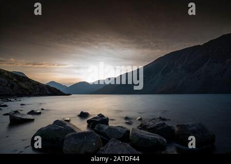 Sunrise over Wast Water a lake located in Wasdale, a valley in the western part of the Lake District National Park, England, it is the deepest lake in Stock Photo