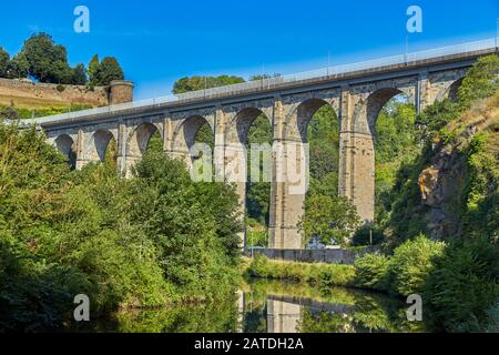 Image of the stone road viaduct over the Canal d'ille du Rance at Dinan, Brittany, France Stock Photo