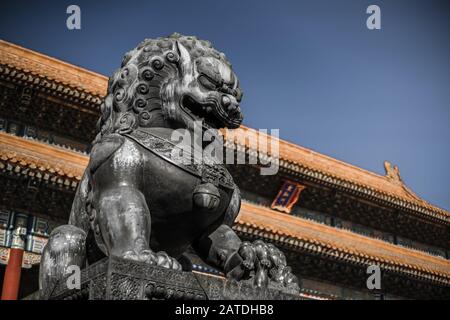 Traditional chinese lion at Forbidden City in Beijing with a blurred background. Stock Photo