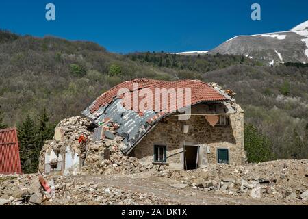 Ruined house in village of Piedilama, destroyed by earthquakes in October 2016, Monti Sibillini National Park, Central Apennines, Marche, Italy Stock Photo