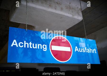 Sign with the inscription attention exit at an underground car park in Germany Stock Photo