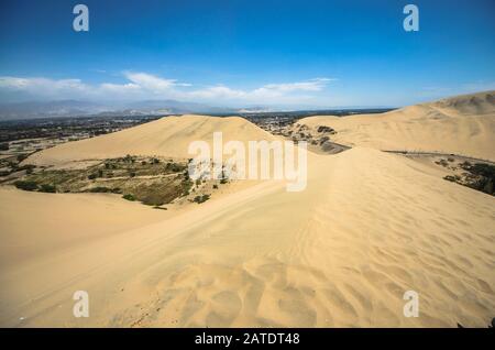 Hucachina oasis and sand dunes near Ica, Peru Stock Photo