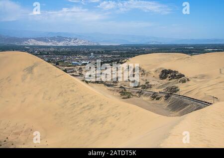 Hucachina oasis and sand dunes near Ica, Peru Stock Photo