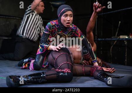 Nor 'Phoenix' Diana, 20, female wrestling champion from Malaysia and the world's first hijab-wearing professional wrestler. London, UK. Stock Photo