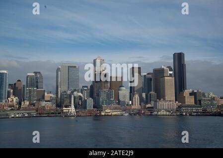 Seattle skyline from Bainbridge island ferry with water Stock Photo