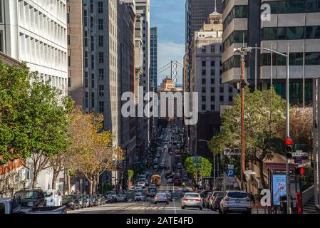Classic view of historic traditional Cable Cars riding on famous California Street, San Francisco, California, USA