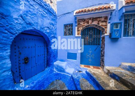 Traditional blue door on an old street inside Medina of Chefchaouen, Morocco Stock Photo