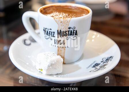 ISTANBUL - DEC 28: Traditional Turkish Coffee in Cup with HAFIZ MUSTAFA 1864 Logotype in Istanbul on December 28. 2019 in Turkey Stock Photo