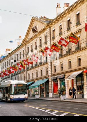 Tram on Rue Corraterie Street Swiss flags in Geneva Swiss Stock Photo