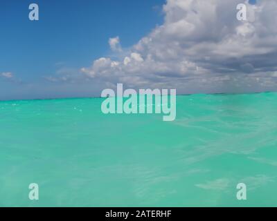 ripples of the Caribbean sea and cloudy sky on the horizon, perspective concept Stock Photo