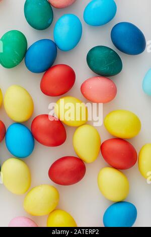 holiday preparation Multi colors Easter eggs with cookies on colored ...