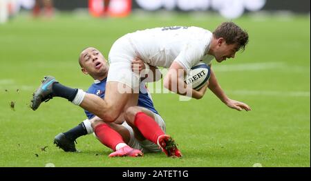 England's George Furbank is tackled by France's Gael Fickou during the Guinness Six Nations match at the Stade de France, Paris. Stock Photo