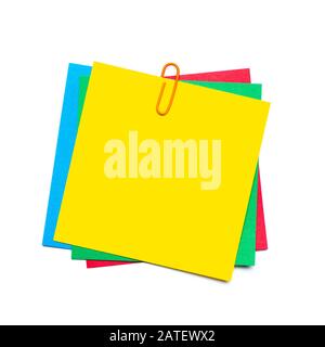 Yellow stick note with paper clip isolated Stock Photo