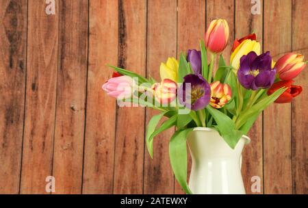 Springtime - Beginning of the year - Tulips on colored background Stock Photo