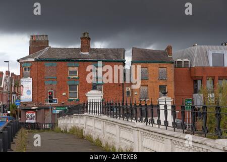 Stormy skies over the old Packet House, Warrington, Cheshire, seen from Warrington Bridge over the River Mersey, 2019 Stock Photo