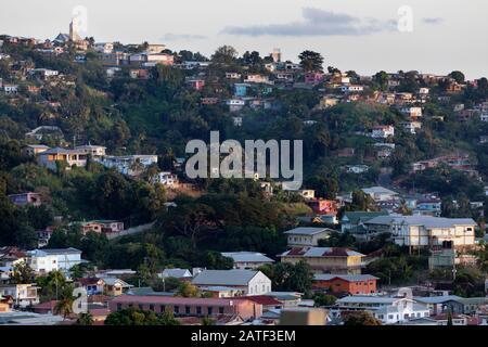 Houses on forested hillside neighborhood, Port of Spain, Trinidad & Tobago Stock Photo