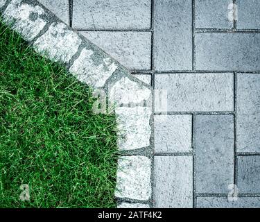 Cobblestone and grass view from above Stock Photo