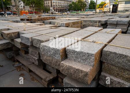 Pile of marble blocks in on pallets in outdoor construction area Stock Photo