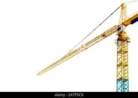 Construction crane tower isolated on white background. Crane and building working progress. Yellow lifting faucet. Empty Space for text. Construction Stock Photo