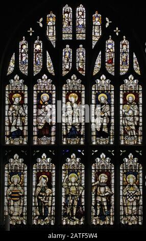 Stained Glass Window by The Kempe Studios depicting Saints, East Window,  Collegiate Church of St Bartholomew, Tong, Shropshire Stock Photo