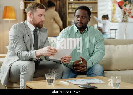 Black man with consultant on mortgage Stock Photo