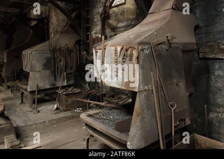Blacksmith's forges and tools at the former workshops of the Dinorwic quarry in Llanberis Wales Stock Photo