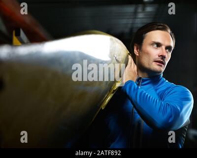 Male athlete getting ready for boating Stock Photo