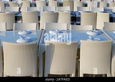 Rows of tables in a street restaurant. Stock Photo