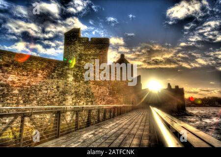Blackness Castle, Blackness, Scotland. Artistic view of the western façade of Blackness Castle, with the 19th century pier in the foreground. Stock Photo