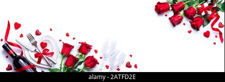 Valentines Day Dinner - White Romantic Table Setting With Wine And Red Roses Stock Photo