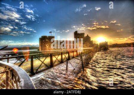 Blackness Castle, Blackness, Scotland. Artistic view of the western façade of Blackness Castle, with the 19th century pier in the foreground. Stock Photo