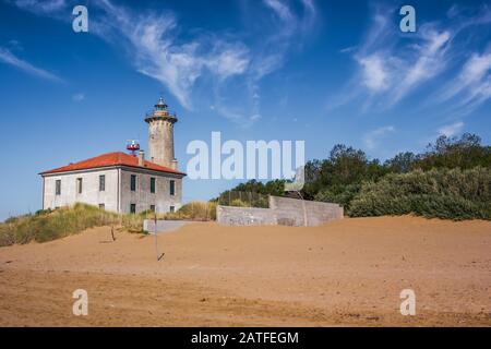 The lighthouse on the beach at the mouth of the river Tagliamento, Bibione, Venezia, Italy. Nice sunny weather. Famous travel destination. Stock Photo