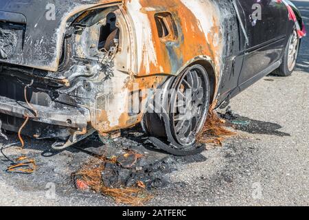 Burnt out car after a severe accident, Germany Stock Photo