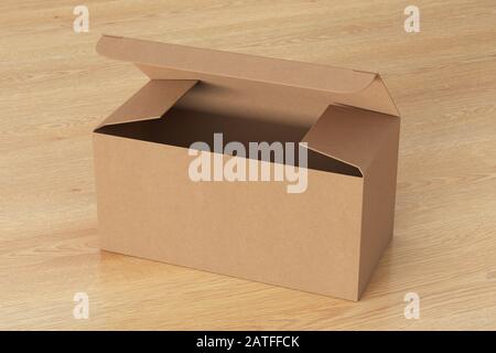 Blank cardboard wide box with opened hinged flap lid on wooden background. Clipping path around box mock up Stock Photo