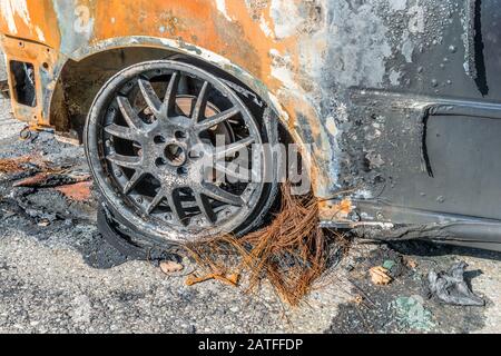 Burnt out car after a severe accident, Germany Stock Photo