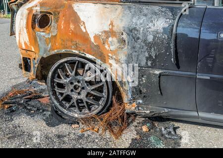 Burnt out car after a severe accident, Germany Stock Photo