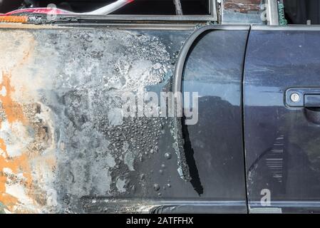 Burnt out car after a severe accident, Germany Stock Photo