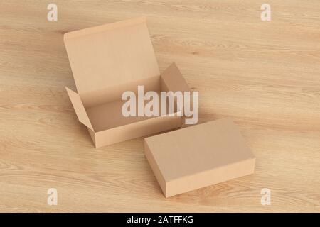 Blank cardboard wide flat box with open and closed hinged flap lid on wooden background Stock Photo