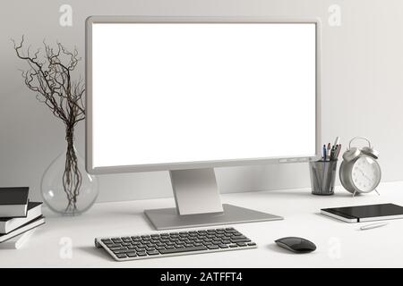Workspace with blank computer monitor white screen mock up on the white desk near white wall. monitor; screen; computer; mock up; Stock Photo