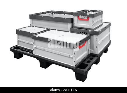 Plastic crates and boxes at transport pallet  isolated on white background Stock Photo