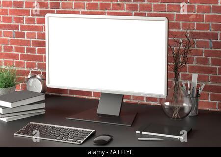 Workspace with blank computer monitor white screen mock up on the dark desk near red brick wall. monitor; screen; computer; mock up; Stock Photo