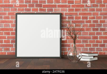 Blank square poster frame mock up standing on dark parquet floor next to red brick wall with vase and books. Clipping path around poster. 3d illustrat Stock Photo