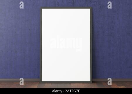 Blank vertical poster frame mock up standing on dark parquet floor next to blue wall. Clipping path around poster Stock Photo