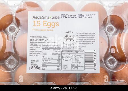 Close up food label on egg box from ASDA explaining UK Egg Codes. Plastic food packaging, nutrition labels, food labelling, British Lion Quality logo. Stock Photo