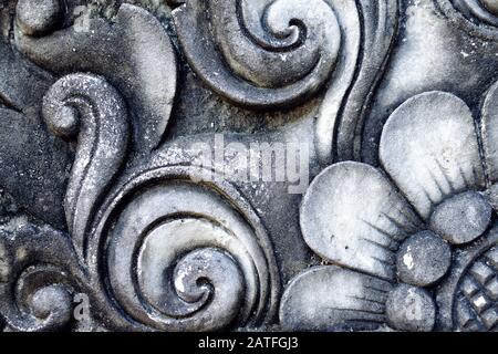 Old wall with relief cement. Balinese decor stone carving. Stock Photo