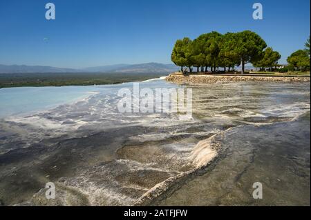 Mineral-rich thermal waters flowing down travertine terraces in Pamukkale, Turkey Stock Photo