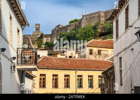 Castle over 19th-century traditional Ottoman style houses, in Gjirokastra (Gjirokaster), UNESCO World Heritage Site, Albania Stock Photo