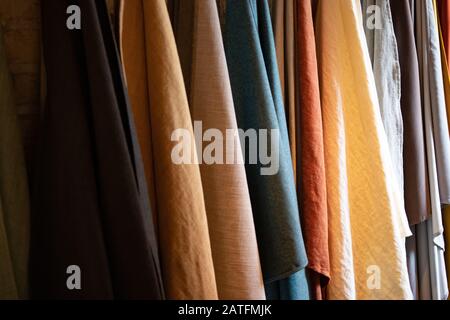 Tie-dyed fabrics from natural colors, hung on a clothesline arranged in rows. Wool Stock Photo