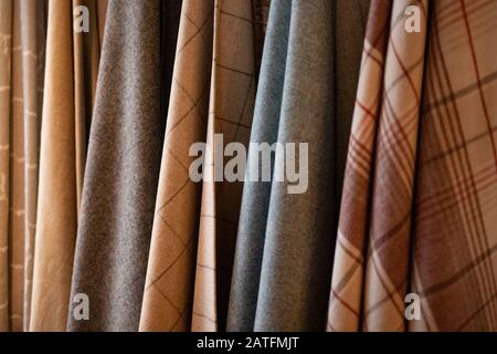 Tie-dyed fabrics from natural colors, hung on a clothesline arranged in rows. Wool Stock Photo