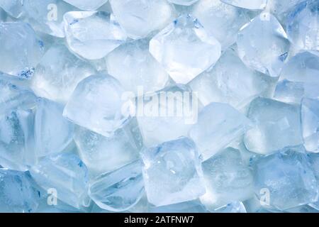 Ice cubes background texture with soft blue glowing Stock Photo